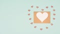 Alentine day greeting card, envelope with hearts on pastel background, love symbol, flat lay