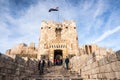 Aleppo, Syria, Visitors exit the gate of Aleppo citadel at the end of 2010 shortly before start of Syrian civil war