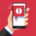 Alert message mobile notification. Hand holding smartphone with exclamation sign, virus notification on phone screen Royalty Free Stock Photo