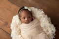 Alert Newborn Baby Girl Swaddled in a Stretch Wrap Royalty Free Stock Photo