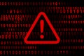 Alert warning sign with digital binary code in the background. Esclamation mark. Hacker, ransomware, malware, ddos attack, cyber