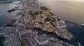 Alesund, Norway. Aerial view of Alesund, Norway at sunrise. Colorful sky over famous tourisitc destination with sunlight and Royalty Free Stock Photo