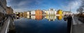 Alesund, Norway - April 14, 2018: Colorful architecture of Alesund reflected in the water of the harbour, Norway Royalty Free Stock Photo