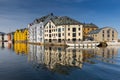 Alesund, Norway - April 14, 2018: Colorful architecture of Alesund reflected in the water of the harbour, Norway Royalty Free Stock Photo