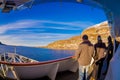 ALESUND, NORWAY - APRIL 09, 2018: Outdoor view of unidentified people taking pictures at frontside of the ship cruise in