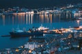 Alesund, Norway. Moored Ship In Port. Night View Of Alesund Skyline Cityscape. Summer Evening.