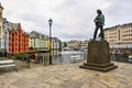 Monument to the young fisherman. Cityscape of the beautiful neo-Gothic architecture of Alesund city. Norway Royalty Free Stock Photo