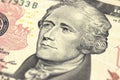 Alexander Hamilton face on US ten or 10 dollars bill macro, united states money closeup.