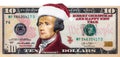 Alexander Hamilton from US 10 dollar banknote in Santa Claus hat