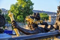 Alexander III bridge in Paris, nymph of Seine, dawn rays