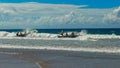 ALEXANDRA HEADLAND, QUEENSLAND, AUSTRALIA- APRIL 21, 2016: a marshall readies surf boats at the start of a race