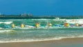 ALEXANDRA HEADLAND, QUEENSLAND, AUSTRALIA- APRIL 24: surf ski race competitors leaving the beach in a race