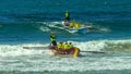 ALEXANDRA HEADLAND, QUEENSLAND, AUSTRALIA- APRIL 22, 2016: two surf boats catching waves at the end of a race