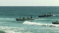 ALEXANDRA HEADLAND, QUEENSLAND, AUSTRALIA- APRIL 21, 2016: wide angle view of several surf boats finishing a race