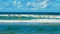 ALEXANDRA HEADLAND, QUEENSLAND, AUSTRALIA- APRIL 24: wide shot of men`s surf ski race on the sunshine coast of australia