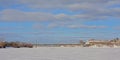 Alexandra Interprovincial bridge over frozen Ottawa river on winter day with snow