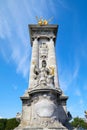 Alexandre III bridge column with golden statue in a sunny day, blue sky in Paris, France Royalty Free Stock Photo