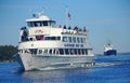 Alexandria Bay, New York, U.S.A - October 24, 2019 - The view of cruise boat with passengers passing by St Lawrence River and