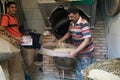 The baker sifts the flour before the next step. Alexandra , Egypt