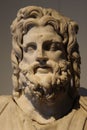 Statue head depicting Serapis god in Greek era .
