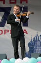 Alexey Alexeyev play on violin during event `Day of the Moscow city` in Znamya Oktyabrya