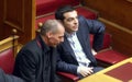 Alexis Tsipras talks with Finance Minister Yanis Varoufakis