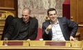 Alexis Tsipras talks with Finance Minister Yanis Varoufakis