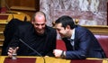 Alexis Tsipras talks with Finance Minister Yanis Varoufakis