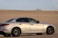 Alfa Romeo Giulia standing in the middle of the desert