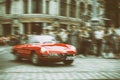 Alfa Romeo on Motoclassic show on vintage effect, motion blur