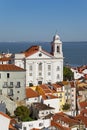 Alfama District with Santo Estevao Church and the Tagus River estuary Royalty Free Stock Photo