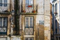 Alfama Lisboa narrow street colored house windows. Lisbon, Portugal Royalty Free Stock Photo