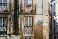 Alfama Lisboa narrow street colored house windows. Lisbon, Portugal