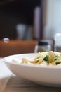 Alfredo spaghetti broccoli chicken white sauce in restaurant background Royalty Free Stock Photo