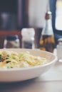 Alfredo spaghetti broccoli chicken white sauce in restaurant background Royalty Free Stock Photo