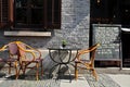 Alfresco restaurant table cane chairs and chalkboard menu
