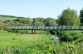 Foot bridge across the River Cuckmere at Alfriston. Royalty Free Stock Photo