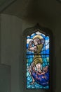 ALFRISTON, SUSSEX/UK - JULY 23 : Stained glass window inside St Royalty Free Stock Photo