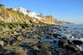 Algae covered boulders on shore of Cress Street Beach in Laguna Beach, California. Royalty Free Stock Photo