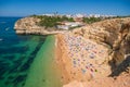 ALGARVE, PORTUGAL - July 2018: Beach cave of Benagil in Carvoeiro, a popular tourist attraction considered one of the most beautif