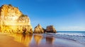 Algarve, Portugal, a stunning sea ocean landscape with yellow rocks and azure water. The beauty of nature and the power Royalty Free Stock Photo