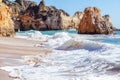 Algarve, Portugal, a stunning sea ocean landscape with yellow rocks and azure water. The beauty of nature and the power Royalty Free Stock Photo