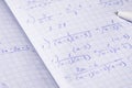 Algebraic calculations in open graph notebook with white pen. White paper with fractions Royalty Free Stock Photo