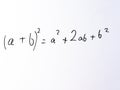 Algebraic square formula expansion written on whiteboard ab\' binomial square rule, formula for (a+b Royalty Free Stock Photo