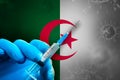 Algeria Covid-19 Vaccination Campaign. Hand in a blue rubber glove holds a syringe with covid-19 virus vaccine Royalty Free Stock Photo