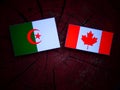 Algerian flag with Canadian flag on a tree stump isolated