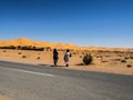 Algerian Sahara desert oasis of Thaghit Bechar Sand dunes behind the road