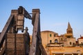 Alghero, Sardinia, Italy - Summer sunset view of the Alghero old town quarter with historic defense walls, fortifications and