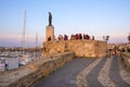 Alghero, Sardinia, Italy - Summer sunset view of the Alghero old town quarter St. Elm Tower - Torre di Sant Elmo - with historic