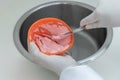 Alginate impression, orthodontist prepares a pink mixture to measure the patient's mouth Royalty Free Stock Photo